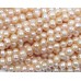 1 Strand Peach Potato Shape Freshwater Pearls approx. 5 mm.
