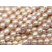 1 Strand Peach Rice Shape Freshwater Pearls approx. 7 mm.
