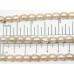 1 Strand Peach Rice Shape Freshwater Pearls approx. 7 mm.
