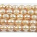 1 Strand Peach Rice Shape Freshwater Pearls approx. 7 mm.