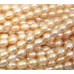 1 Strand Peach Rice Shape Freshwater Pearls approx. 7 mm.