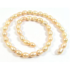 1 Strand Peach Rice Shape Freshwater Pearls approx. 7 mm.