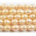 1 Strand Peach Rice Shape Freshwater Pearls approx. 7 mm.