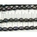 1 Strand Gunmetal Rice Shape Freshwater Pearls approx. 10 mm.
