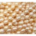 1 Strand Peach Rice Shape Freshwater Pearls approx. 10 mm.