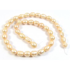 1 Strand Peach Rice Shape Freshwater Pearls approx. 10 mm.